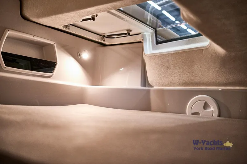 Slide: The Image of Interior cabin of 2023 Yamarin 88 boat with skylight and modern lighting. - 7