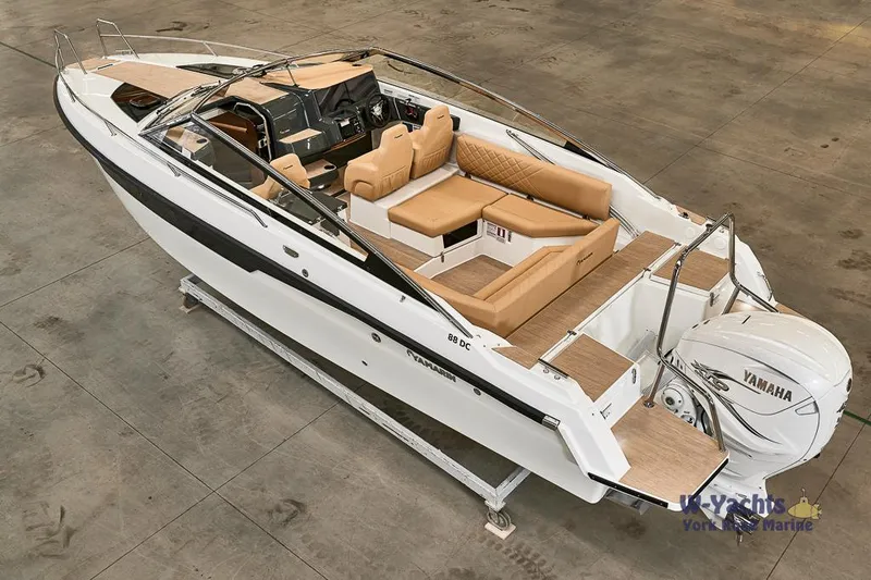 Slide: The Image of 2023 Yamarin 88 boat with Yamaha engine, beige seating, and sleek design. - 9