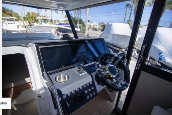 Slide: The Image of Cockpit of 2025 Quarken 35 boat with modern steering and navigation systems. - 13