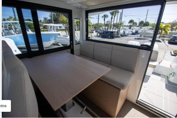 Slide: The Image of Interior of 2025 Quarken 35 boat with seating and table, showcasing modern design. - 15