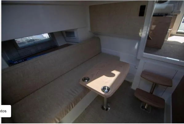 Slide: The Image of Interior of 2025 Quarken 35 boat with cozy seating and wooden table. - 16