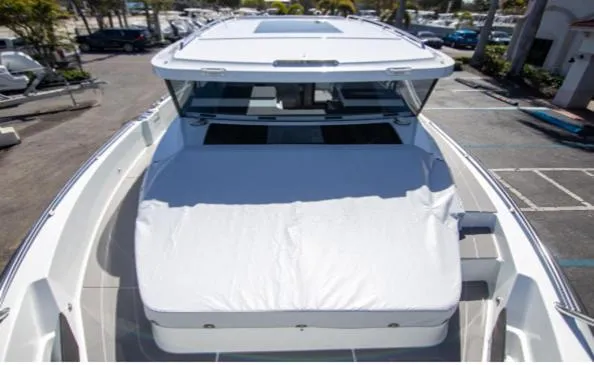 Slide: The Image of 2025 Quarken 35 boat with sleek design, docked in a marina. - 9