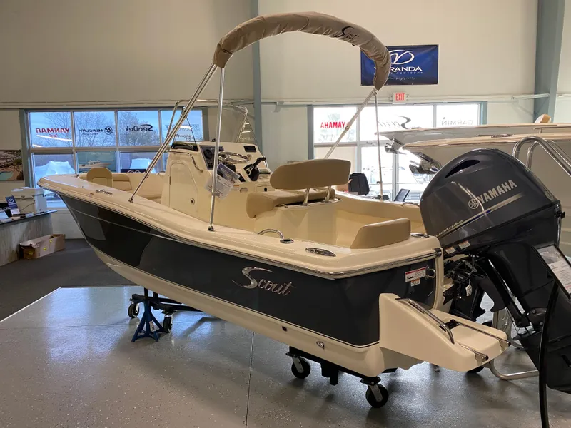 The Image of 2025 Scout 195 Sportfish boat with Yamaha outboard motor in showroom. - 0