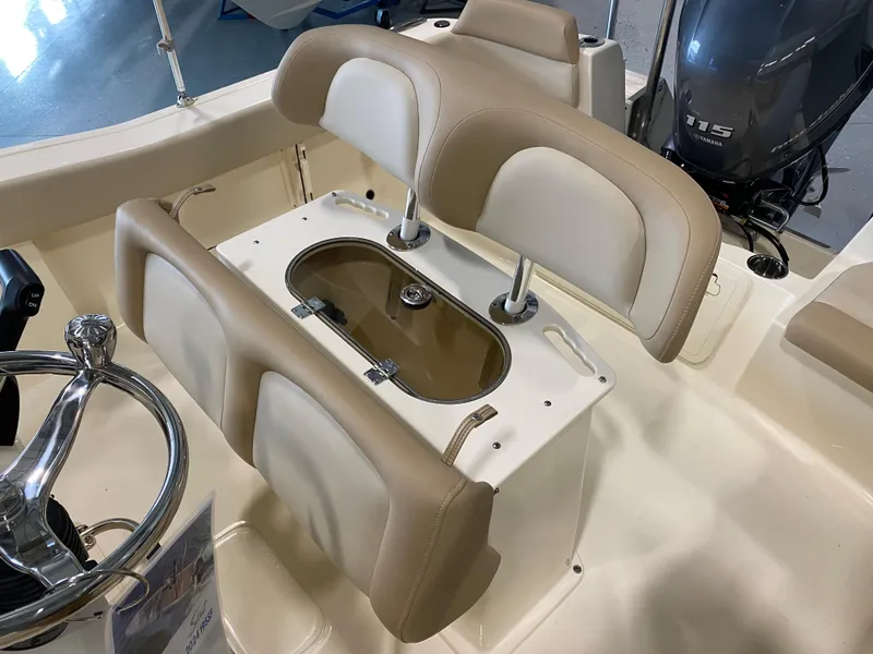 Slide: The Image of 2025 Scout 195 Sportfish boat interior with dual beige seats and livewell. - 4