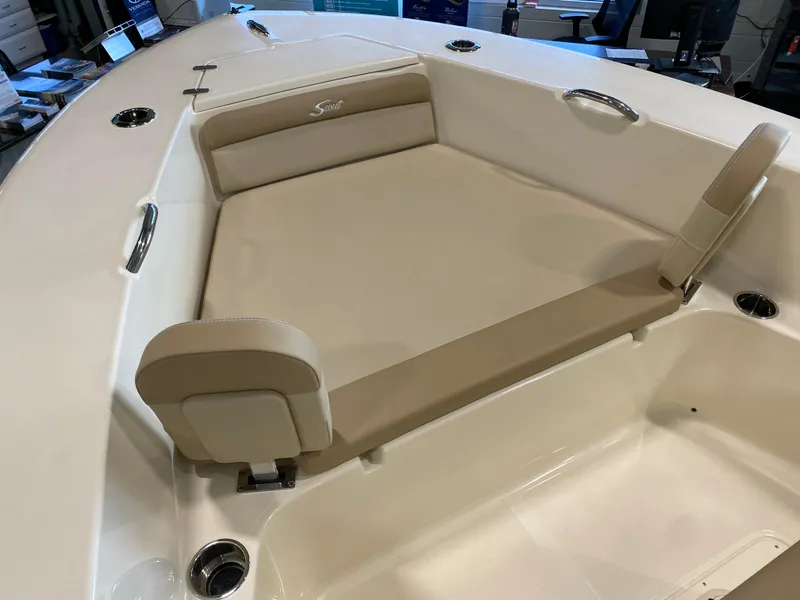 Slide: The Image of 2025 Scout 195 Sportfish boat with beige cushioned seating area. - 6