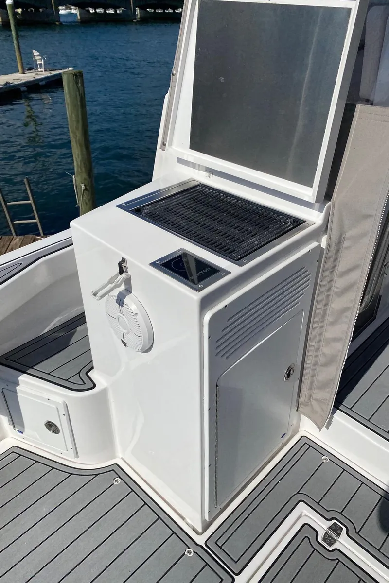 Slide: The Image of 2022 NorthCoast 315 boat with onboard grill and sink station. - 14