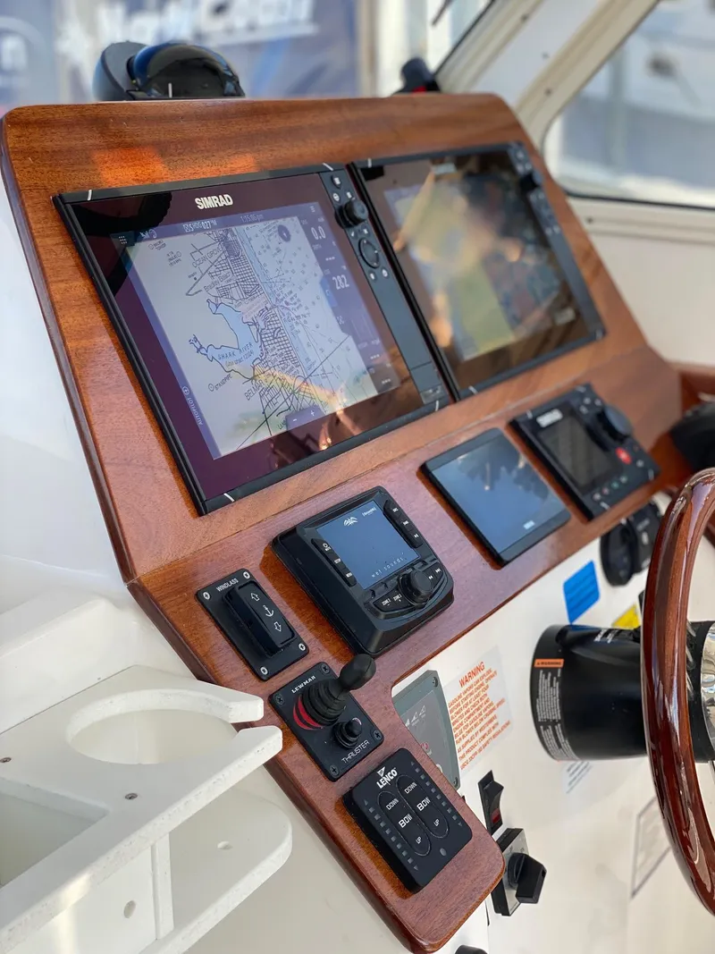 Slide: The Image of 2022 NorthCoast 315 boat dashboard with navigation and control systems. - 11