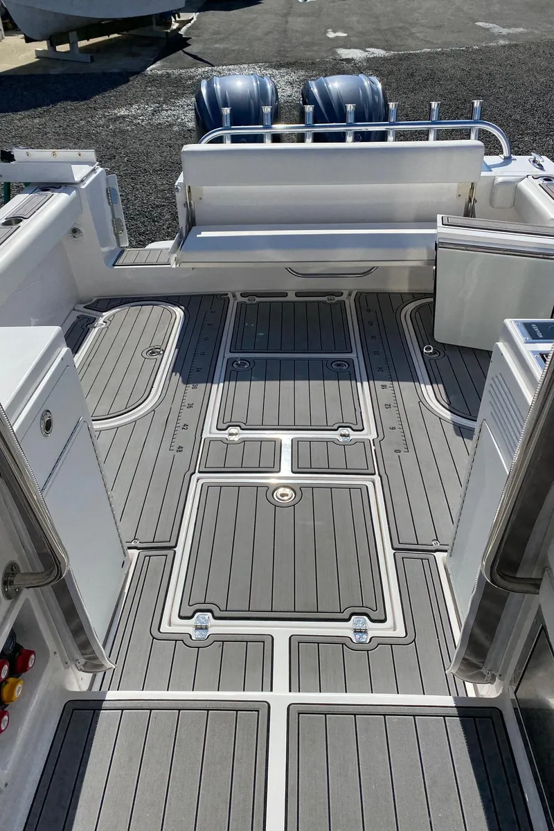 Slide: The Image of 2022 NorthCoast 315 boat deck with twin outboard motors. - 13