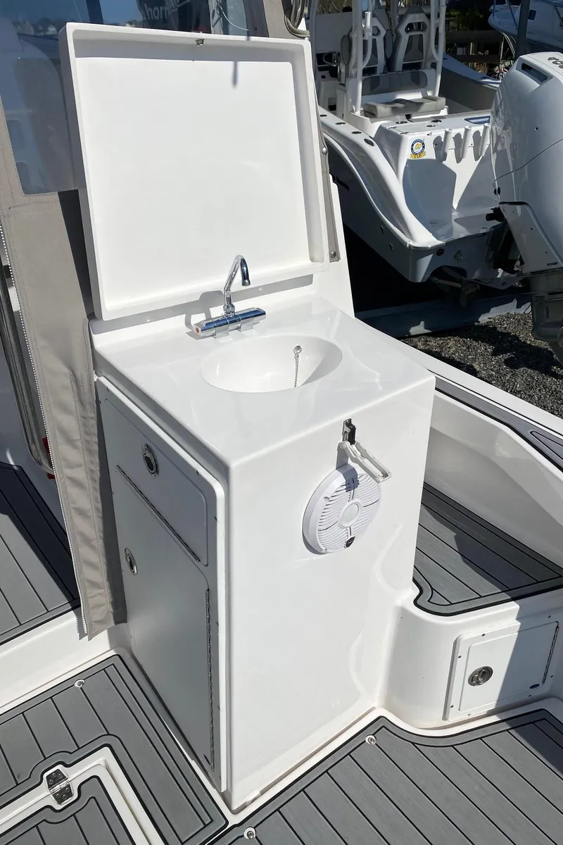 Slide: The Image of 2022 NorthCoast 315 boat sink and storage unit on deck - 15