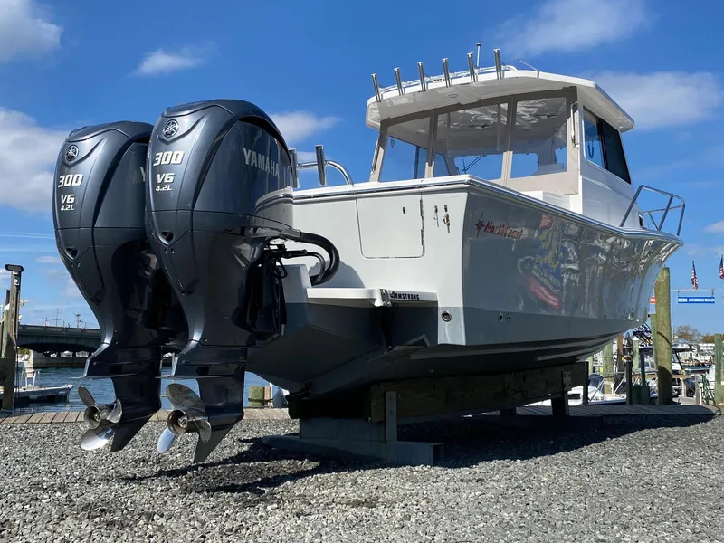 Slide: The Image of 2022 NorthCoast 315 boat with twin Yamaha 300 V6 engines on display. - 2