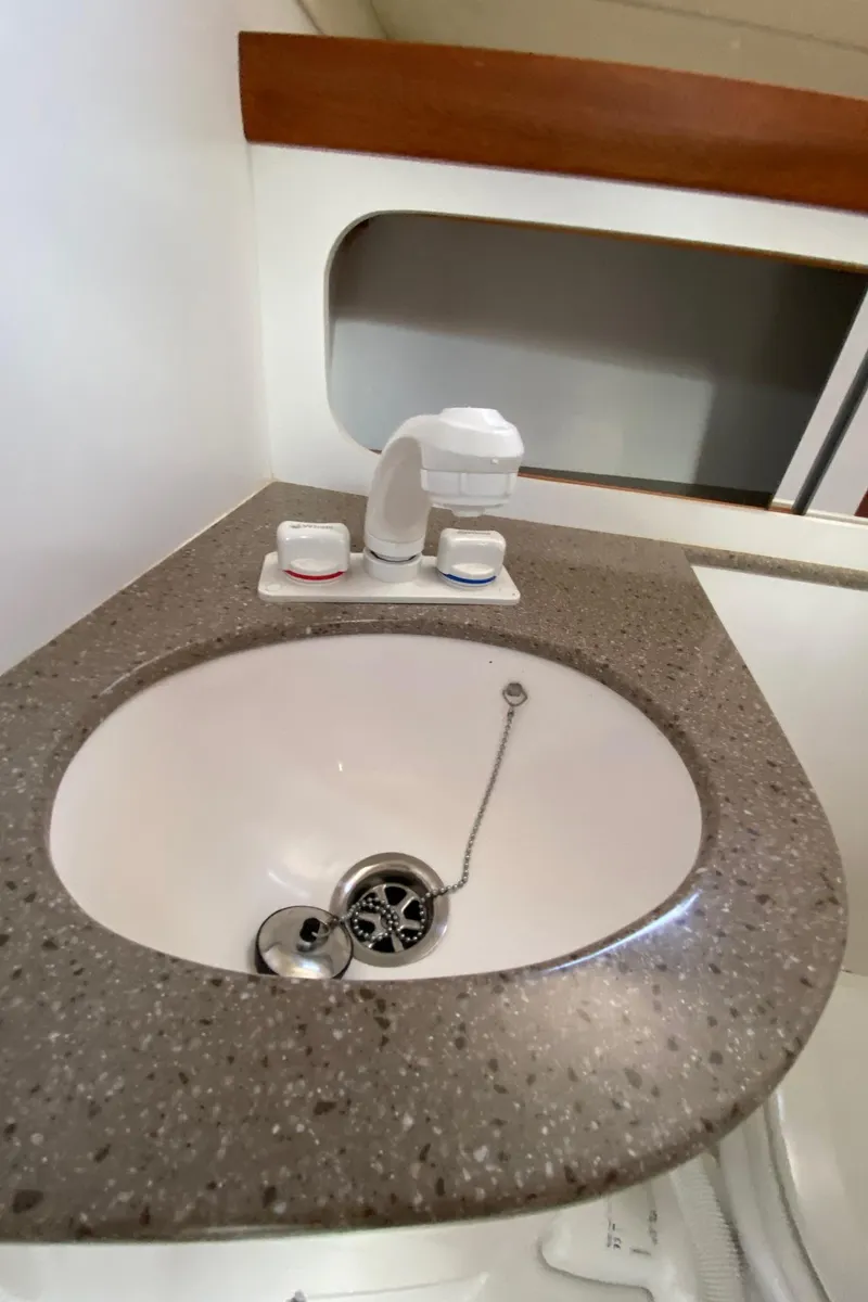 Slide: The Image of 2022 NorthCoast 315 boat bathroom sink with modern fixtures. - 22