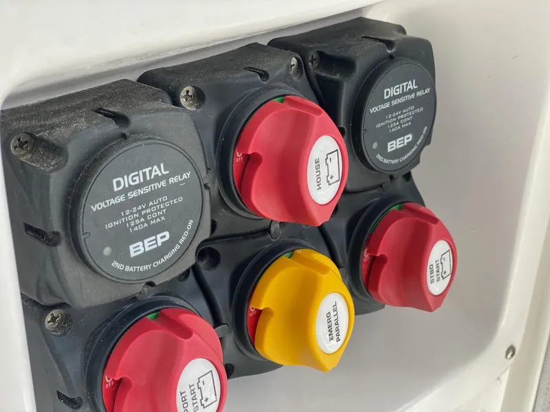Slide: The Image of Digital voltage sensitive relay switches on a 2022 NorthCoast 315 boat. - 27