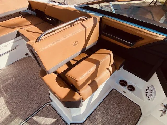 Slide: The Image of 2023 Cobalt R6 boat interior with tan leather seats and modern design. - 18