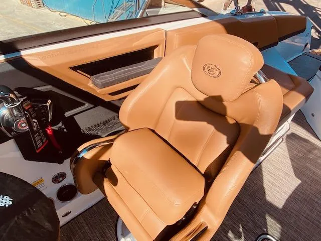 Slide: The Image of 2023 Cobalt R6 boat with luxurious tan leather captain's chair. - 20