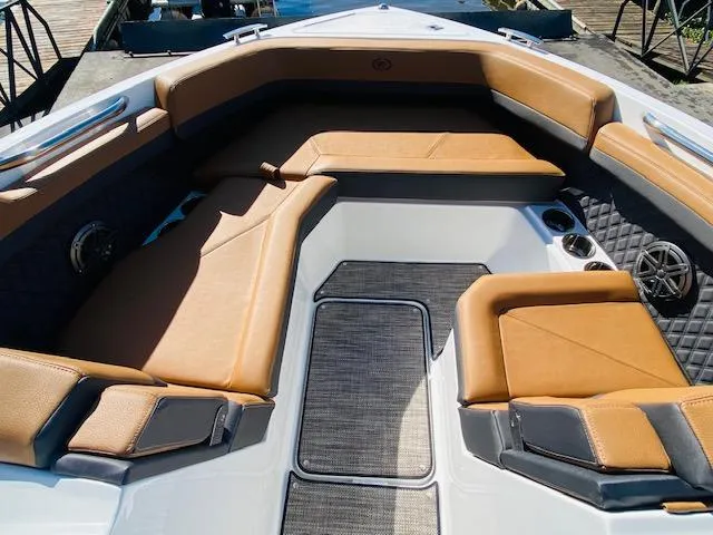 Slide: The Image of 2023 Cobalt R6 boat with luxurious tan leather seating. - 23