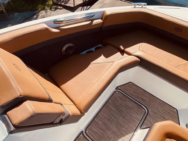 Slide: The Image of Luxurious seating area of 2023 Cobalt R6 boat with tan leather upholstery. - 24