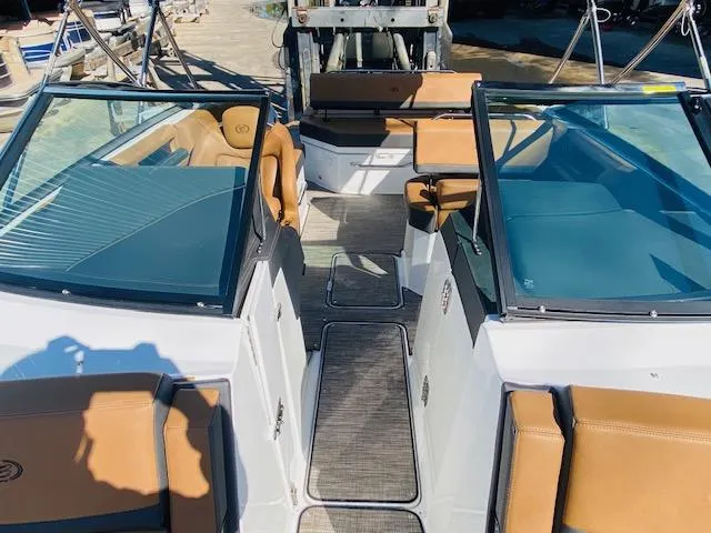 Slide: The Image of 2023 Cobalt R6 boat interior with tan leather seats and open deck layout. - 26