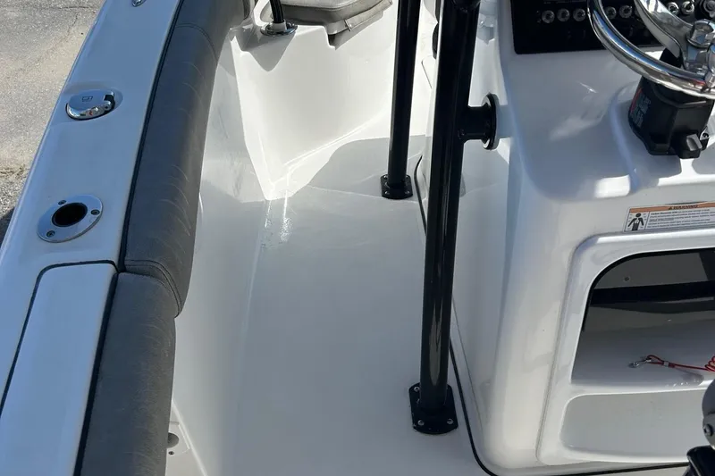 Slide: The Image of 2021 Sea Pro 219 boat interior with steering console and seating area. - 3