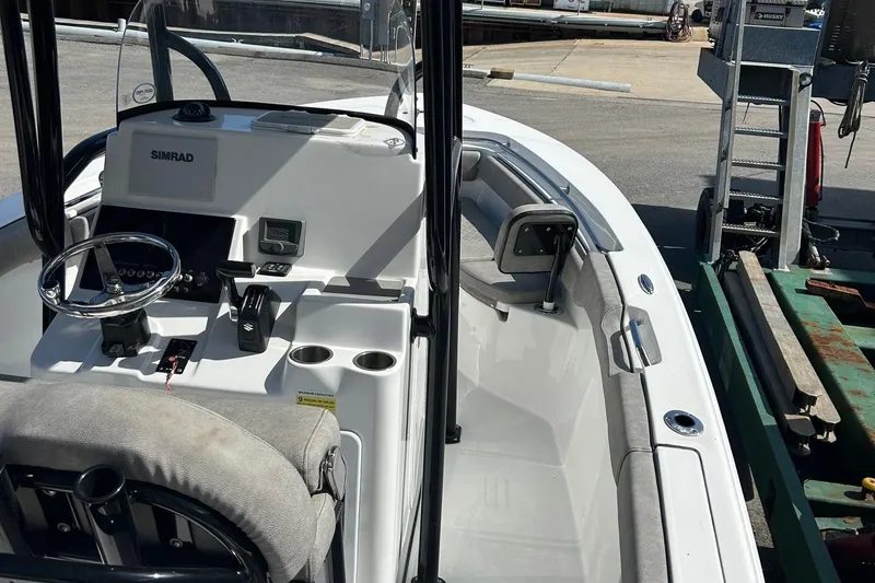 Slide: The Image of 2021 Sea Pro 219 boat interior with steering console and seating. - 6
