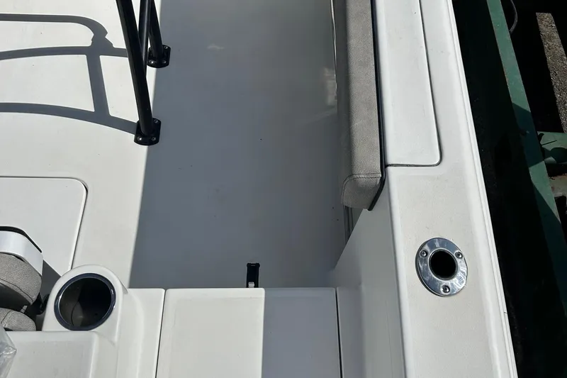 Slide: The Image of 2021 Sea Pro 219 boat interior with seating and cup holder. - 8