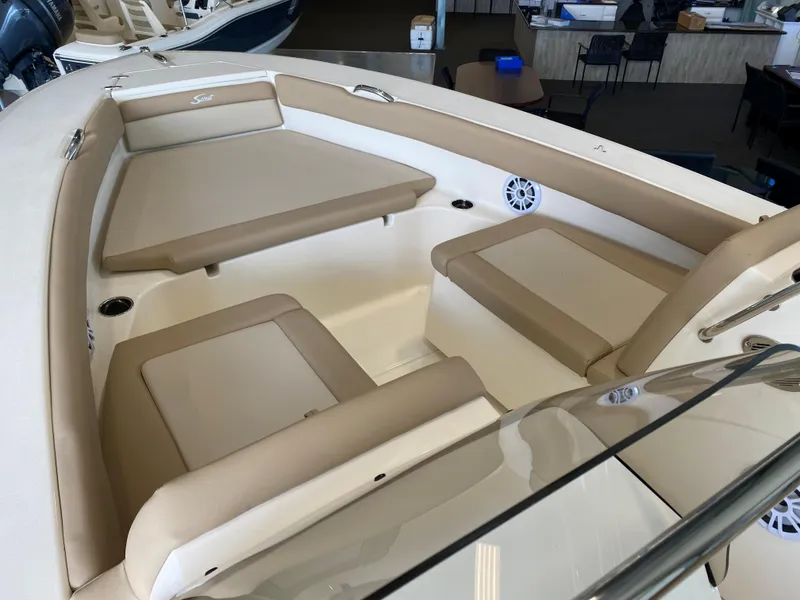 Slide: The Image of 2024 Scout 195 Dorado boat interior with beige seating and white accents. - 3