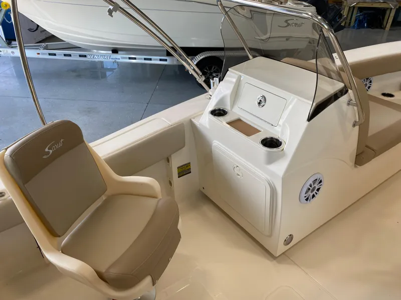 Slide: The Image of 2024 Scout 195 Dorado boat interior with helm station and seating. - 4