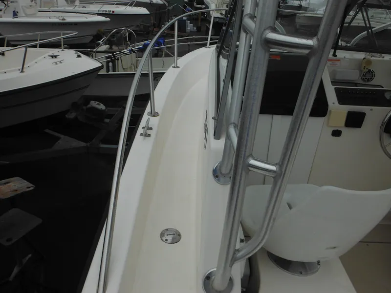 Slide: The Image of 1997 Robalo 2140 Walkaround boat deck and cockpit area. - 12