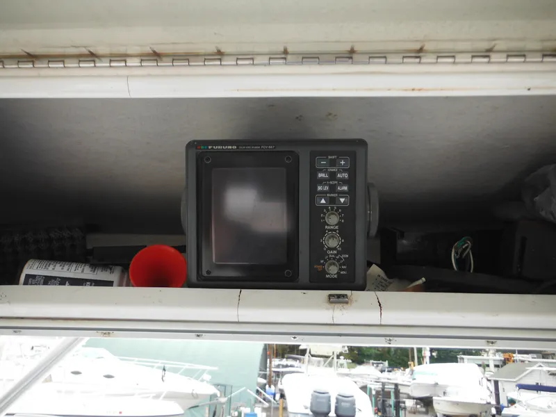 Slide: The Image of 1997 Robalo 2140 Walkaround boat electronics compartment with navigation equipment. - 20