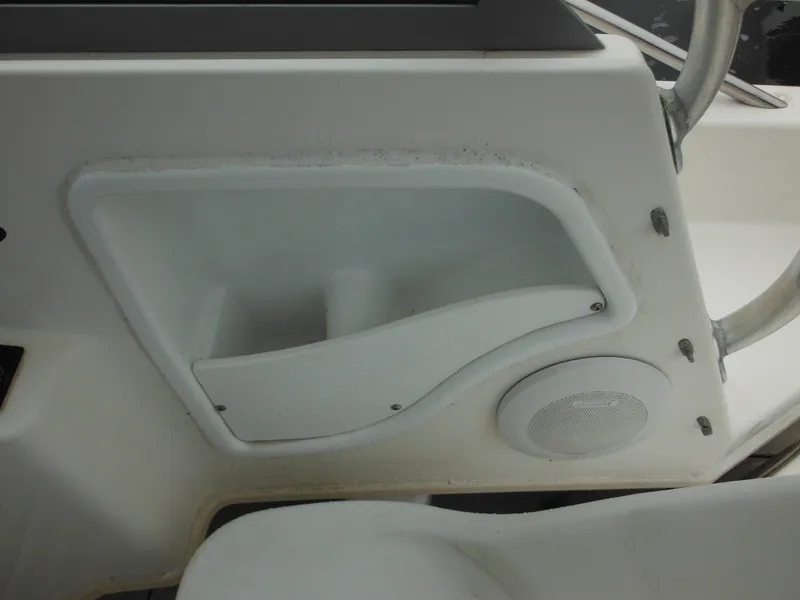 Slide: The Image of 1997 Robalo 2140 Walkaround boat interior storage compartment and speaker. - 22
