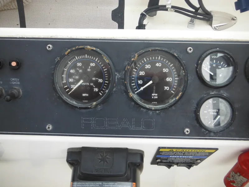 Slide: The Image of 1997 Robalo 2140 Walkaround boat dashboard with speedometer and tachometer. - 27