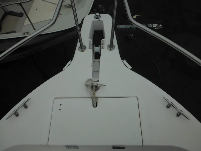Slide: The Image of 1997 Robalo 2140 Walkaround boat bow with anchor and railing. - 28