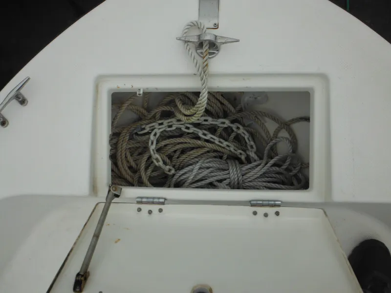Slide: The Image of Anchor storage compartment on a 1997 Robalo 2140 Walkaround boat. - 29