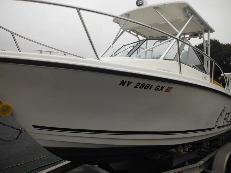 Slide: The Image of 1997 Robalo 2140 Walkaround boat on trailer, side view. - 3