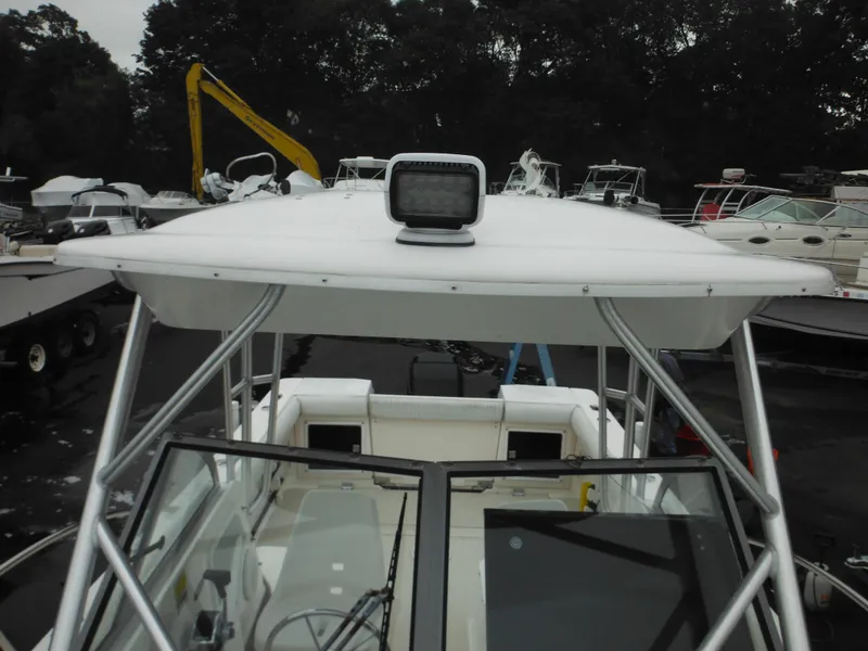 Slide: The Image of 1997 Robalo 2140 Walkaround boat with hardtop and spotlight. - 30