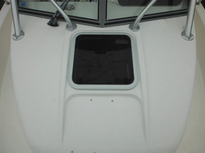Slide: The Image of 1997 Robalo 2140 Walkaround boat deck with hatch and windshield. - 31