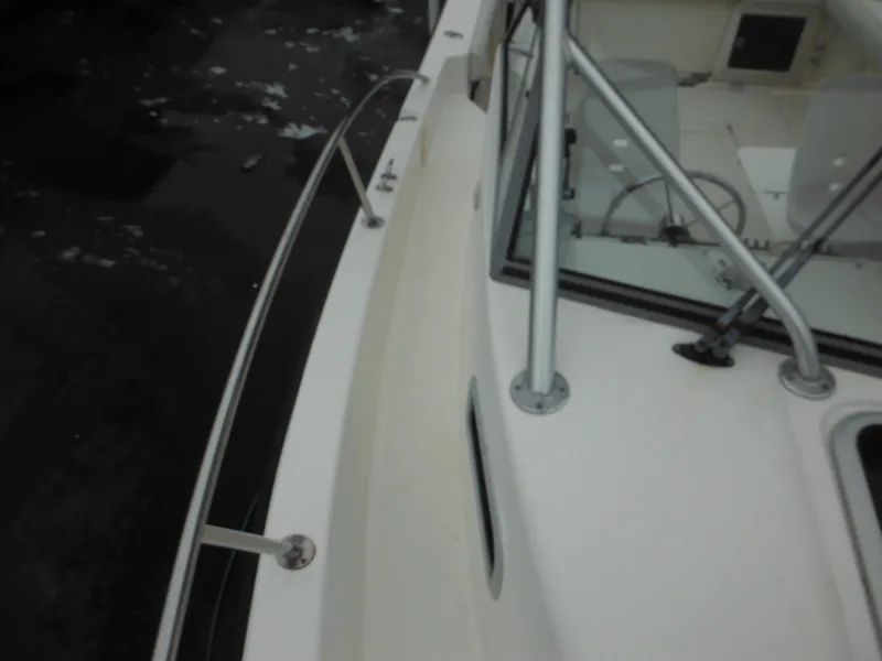 Slide: The Image of 1997 Robalo 2140 Walkaround boat deck and railing. - 32