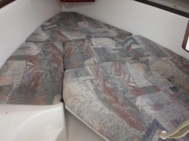 Slide: The Image of 1997 Robalo 2140 Walkaround cabin interior with cushioned sleeping area. - 36