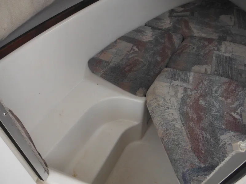 Slide: The Image of 1997 Robalo 2140 Walkaround cabin interior with cushioned seating. - 37
