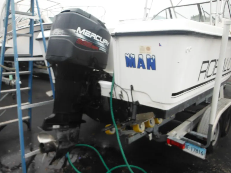 Slide: The Image of 1997 Robalo 2140 Walkaround boat with Mercury outboard motor on trailer. - 4