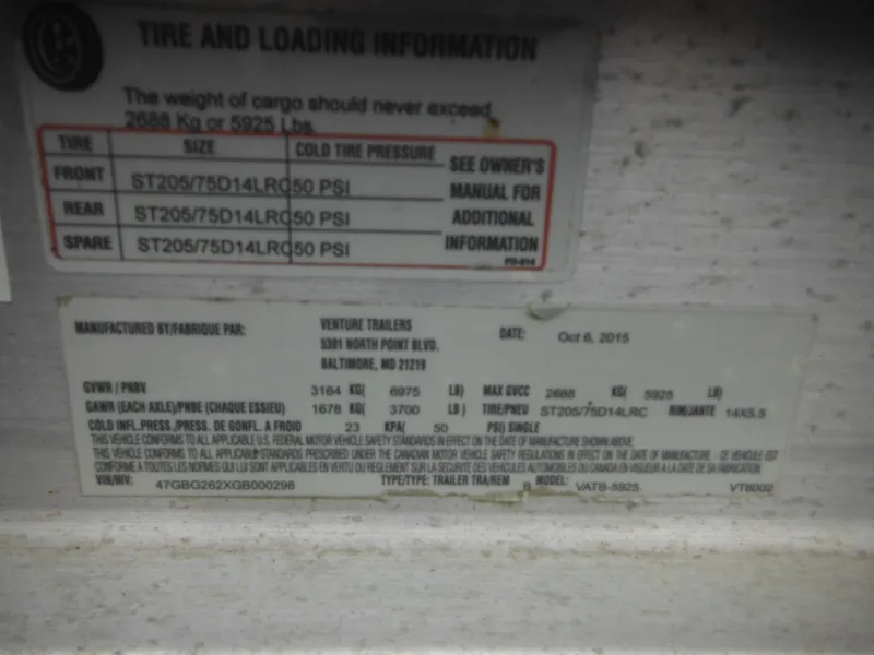 Slide: The Image of Tire and loading information label on a 1997 Robalo 2140 Walkaround boat. - 44