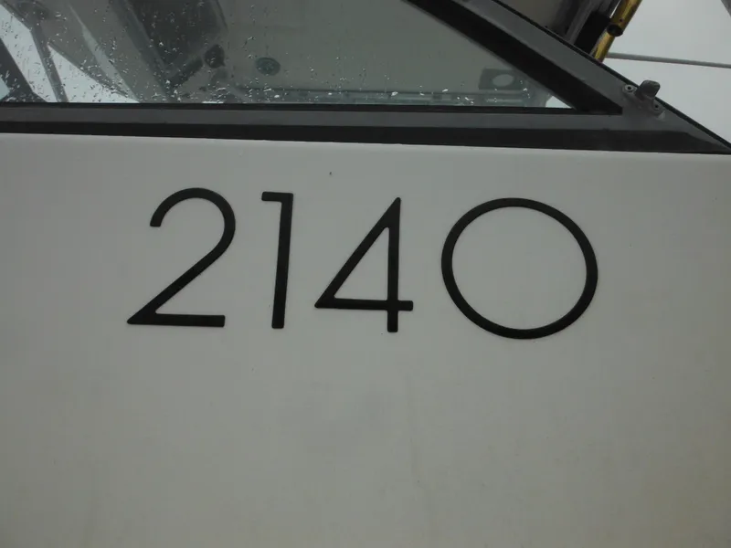Slide: The Image of 1997 Robalo 2140 Walkaround boat model number on hull. - 6