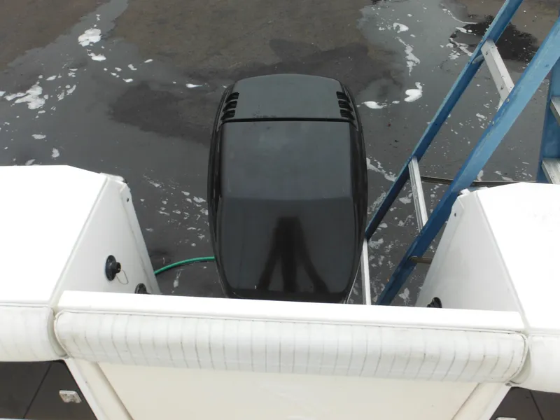 Slide: The Image of 1997 Robalo 2140 Walkaround boat engine and deck view. - 8