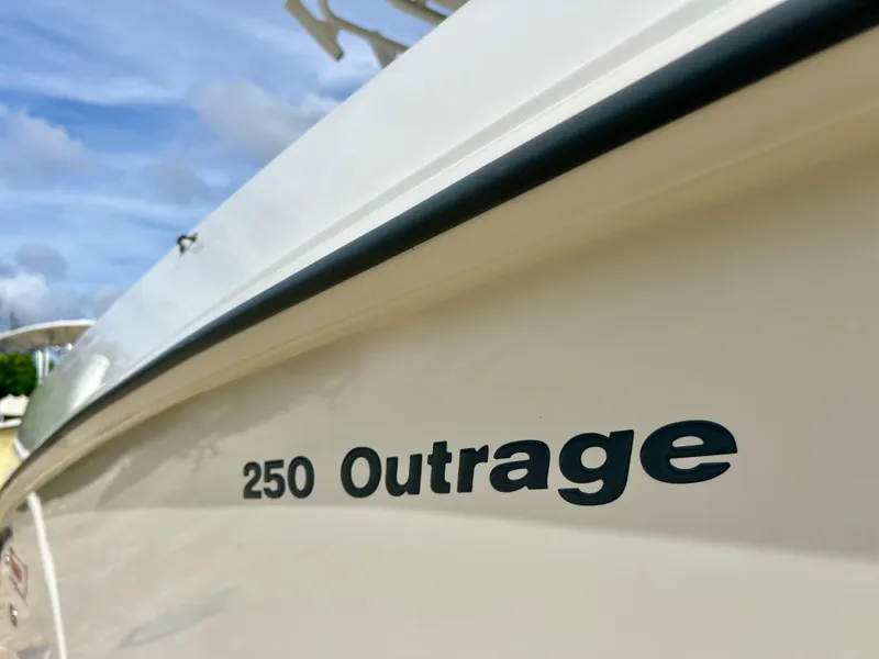 Slide: The Image of Close-up of 2015 Boston Whaler 250 Outrage boat name on hull. - 10