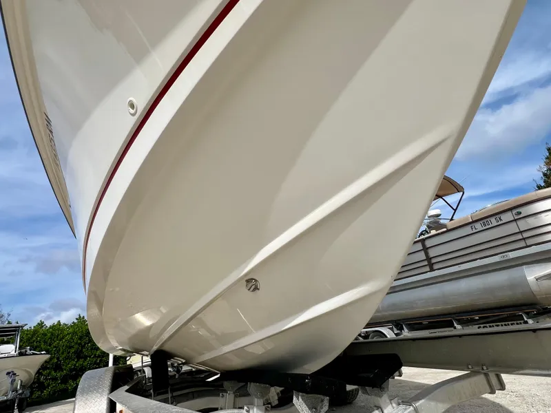 Slide: The Image of 2015 Boston Whaler 250 Outrage boat hull on trailer. - 11
