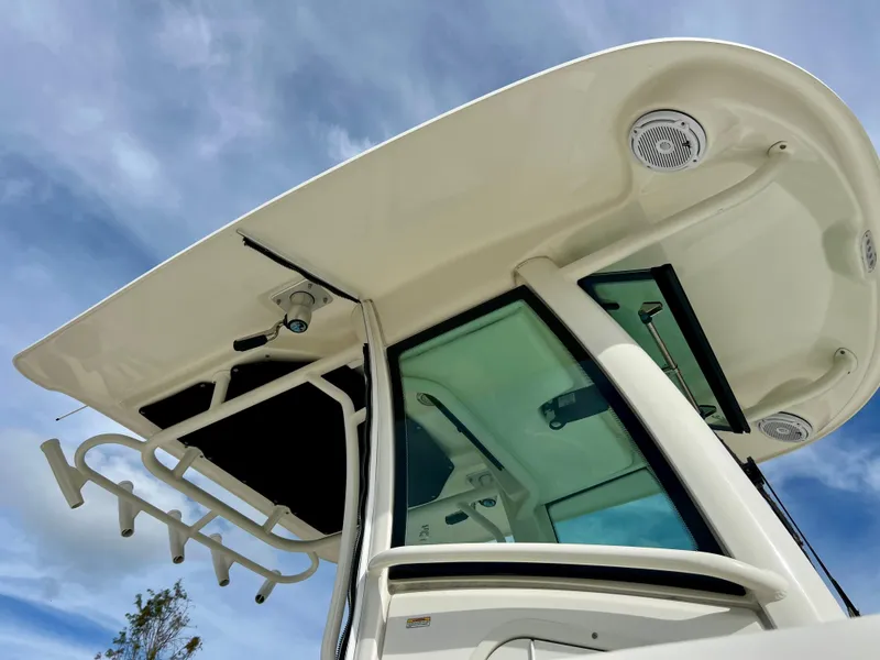 Slide: The Image of 2015 Boston Whaler 250 Outrage boat with hardtop and rod holders. - 12