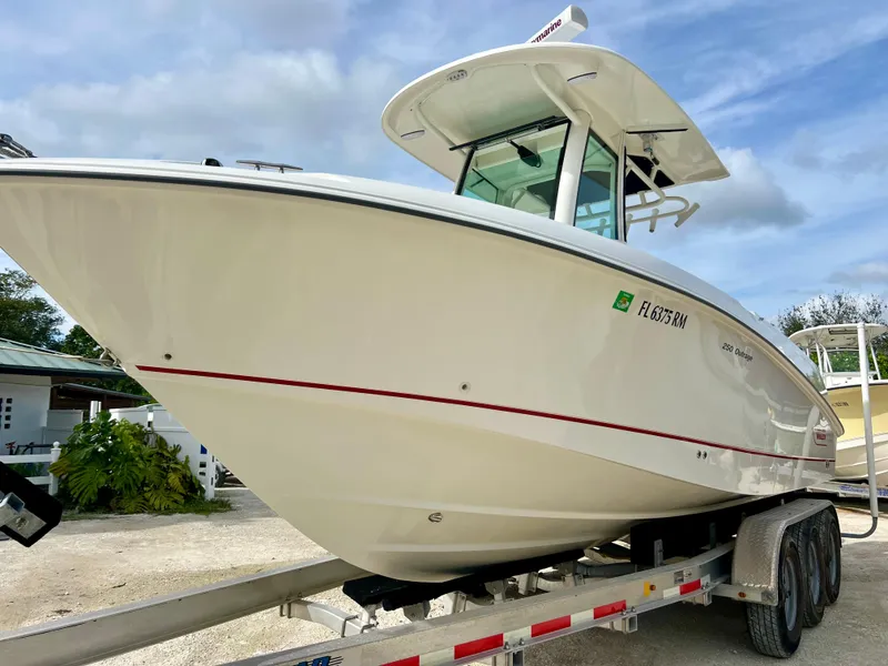 Slide: The Image of 2015 Boston Whaler 250 Outrage boat on a trailer, side view. - 3