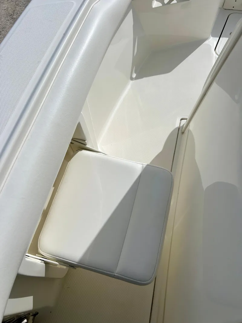 Slide: The Image of 2015 Boston Whaler 250 Outrage boat interior seating area. - 36