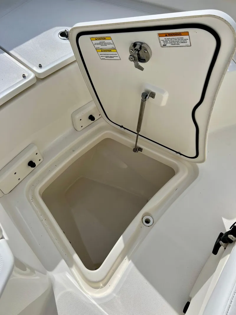 Slide: The Image of Open storage compartment on a 2015 Boston Whaler 250 Outrage boat. - 37