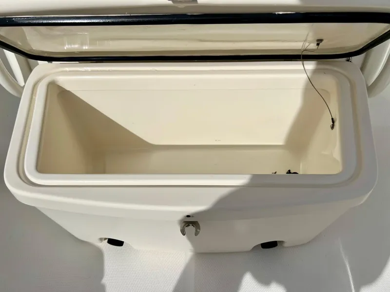 Slide: The Image of Open storage compartment on a 2015 Boston Whaler 250 Outrage boat. - 38