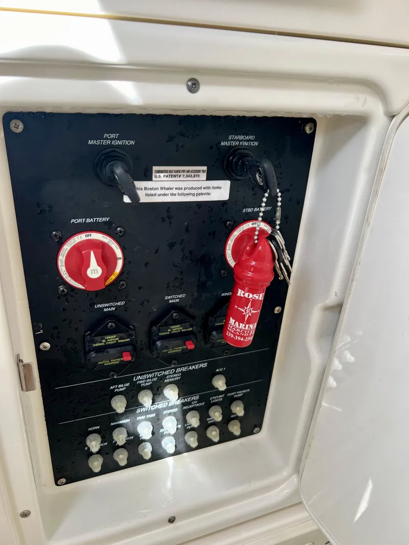 Slide: The Image of Control panel of a 2015 Boston Whaler 250 Outrage boat with safety equipment. - 46